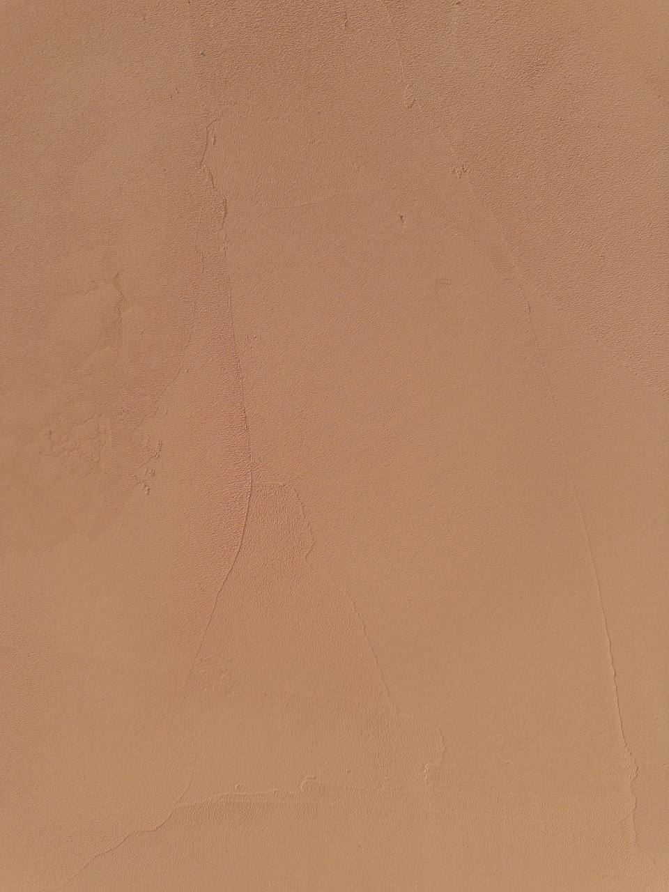 #2 Canyon Beige Romanus clay plaster on a wall, close-up of the matte texture