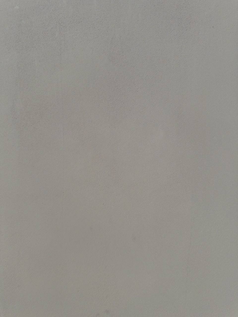 #7 Dusty Mineral Romanus clay plaster on a wall, close-up of the matte texture