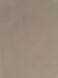 #8 Clay Taupe Romanus clay plaster on a wall, close-up of the matte texture