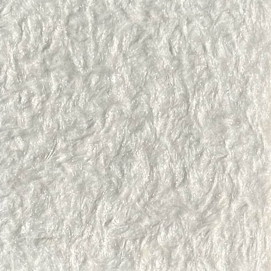 #1 Cotton Cloud Papirus cotton plaster on a wall, close-up of the cotton-fibre texture