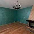 Velvetus decorative silk stucco in teal on a living room wall